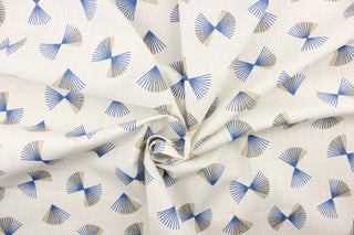  This fabric features an open fan design in blue and tan on a ivory background.  