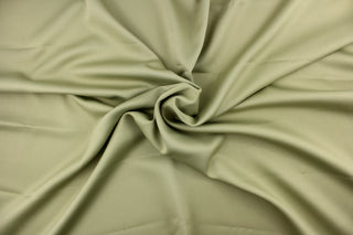 This beautiful versatile fabric offers a slight sheen in olive. 