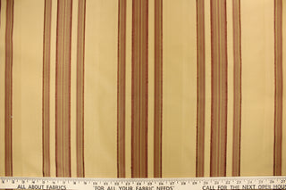  This fabric features a multi width stripe design in tan and a rich red.