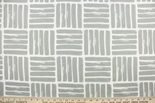 This fabric features a geometric design of thick short stripes in gray against white.
