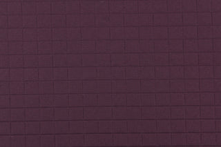 This quilted jacquard fabric in amethyst is durable and hard wearing with a rating of 30,000 double rubs.  It can be used for multi purpose upholstery, bedding, accent pillows and drapery.  