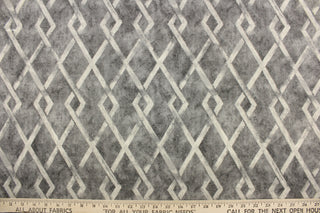 This fabric features a geometric design in gray tones. 