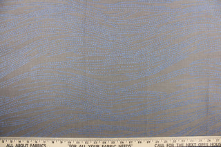 This jacquard fabric features a line design in blue against a dark taupe background.