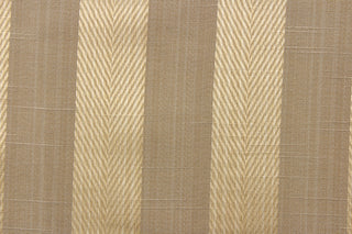  This stunning yarn dyed fabric features a  wide striped pattern in beige and gold. Enhancing the various colors of the stripes is a slight sheen.