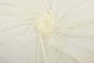 A sheer, light weight, and semi firm tricot in off white.
