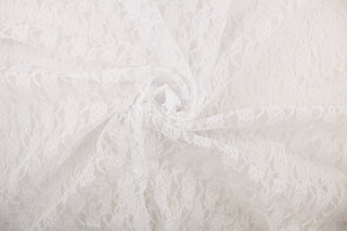 This lace features a woven floral design in white . 