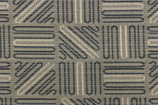 This high end upholstery weight fabric features a geometric design in blue and beige on a metal gray background.  It is suited for uses that requires a more durable fabric.  The reinforced backing makes it great for upholstery projects including sofas, chairs, dining chairs, pillows, handbags and craft projects.  It is soft and pliable and would make a great accent to any room. 