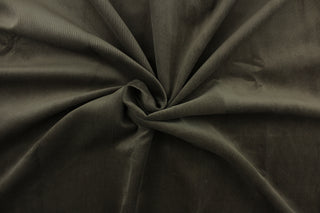 This corduroy fabric features a the typical rib design in  brown charcoal with a cotton scrim backing.