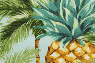 This multi use fabric features large palm trees and pineapples in shades of green, blue, yellow, brown and white.  It is perfect for outdoor settings or indoors in a sunny room.  It is stain and water resistant and can withstand up to 500 hours of direct sun exposure and has a durability rating of 10,000 double rubs.  Uses include decorative pillows, cushions, chair pads, tote bags and upholstery.