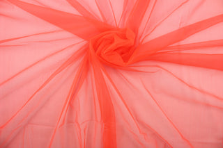 A sheer, light weight, and semi firm tricot in bright neon orange.