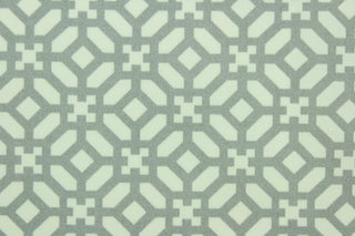  This fabric features a lattice design in gray and white