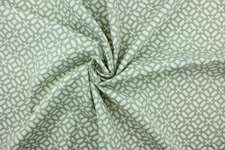  This fabric features a lattice design in gray and white