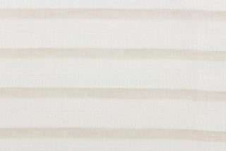 This sheer fabric features a stripe design in beige and white .