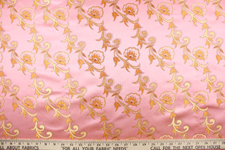 Elegant portrays this jacquard fabric which features intricate woven flowers in gold on a pink background.  Made of 100% polyester this fabric is durable, strong, and wrinkle resistant and has a luxurious feel.  This fabric would compliment any room whether you use it for drapery or throw pillows.  It is also perfect for upholstery, home décor, duvet covers and apparel. The possibilities are endless.  