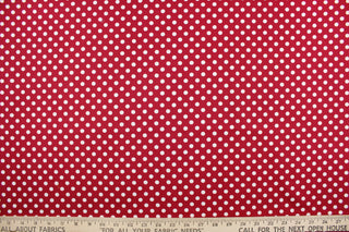 This fun fabric features white polka dots on a red background.  It has a nice soft hand and would be great for quilting, crafting, apparel and home decor.  We offer this fabric in several other colors.