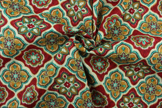 This multi use fabric features a floral medallion design in red, dark aqua, taupe, off white and orange.  It is perfect for outdoor settings or indoors in a sunny room.  It is stain and water resistant and can withstand up to 500 hours of direct sun exposure and has a durability rating of 10,000 double rubs.  Uses include decorative pillows, cushions, chair pads, tote bags and upholstery.