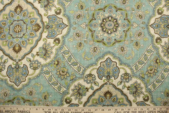 Messina is a linen and viscose blend fabric that features a large medallion design in blue/green, blue, raisin. lime green, sun gold, and sandy beige.  The multi use fabric perfect for window treatments, decorative pillows, custom cushions, bedding, light duty upholstery applications and almost any craft project.  This fabric has a soft workable feel yet is stable and durable with 12,000 double rubs.