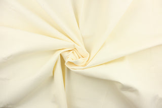  Poplin fabric in a solid creamy white . 
