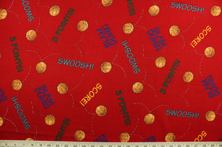 Team Teddy features basketballs and basketball terminology in orange, yellow, green, blue and teal on a red background.  The versatile lightweight fabric is soft and easy to sew.  It would be great for quilting, crafting and sewing projects.  