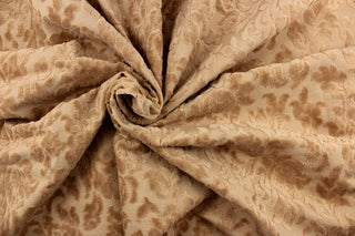  An upholstery velvet featuring a floral design in a rich beige.