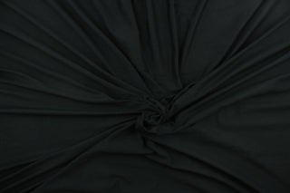 This black cotton jersey fabric, has a 4-way stretch that is soft, durable, breathable and will allow movements of the body.  Uses include t-shirts, sportswear, loungewear, leggings, children's apparel, bedding and sheets.  We offer a variety of jersey fabrics.