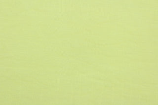 This lemon yellow, cotton jersey fabric, has a 4-way stretch that is soft, durable, breathable and will allow movements of the body.  Uses include t-shirts, sportswear, loungewear, leggings, children's apparel, bedding and sheets.  We offer a variety of jersey fabrics.