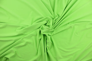 This lime green cotton jersey fabric, has a 4-way stretch that is soft, durable, breathable and will allow movements of the body.  Uses include t-shirts, sportswear, loungewear, leggings, children's apparel, bedding and sheets.  We offer a variety of jersey fabrics.