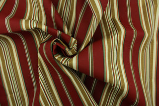 This fabric features varying width stripes in red, green, brown and beige.  The versatile, long-lasting fabric can withstand up to 500 hours of direct sunlight.  It is perfect for lounge cushions, pool furniture, tablecloths, decorative pillows and upholstery projects.  This fabric has a slightly stiff feel but is easy to work with.  