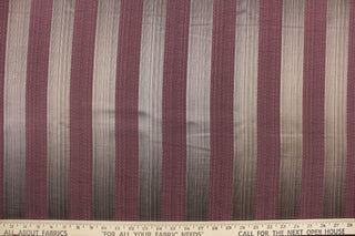 This stunning yarn dyed fabric features a  wide striped pattern in brown and medium purple . 