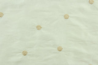 Bracketed features embroidered circles with a scalloped edge.  The sheen enhances and adds an elegant look to the fabric.  Uses include window treatments, accent pillows, bedding, cornice boards and home décor.