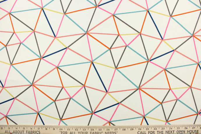 This fabric features a geometric design in hot pink, orange, turquoise, charcoal gray, mustard yellow, and peachy pink against a dull white.