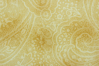 This screen printed fabric features a paisley design in wheat and ivory.  The versatile lightweight fabric is soft and easy to sew.  It would be great for quilting, crafting and sewing projects.  