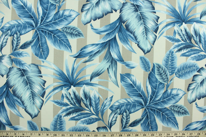 This screen printed fabric features large tropical foliage in shades of blue and white against a striped cream and stone background.  It is perfect for any project where the fabric will be exposed to the weather.  Able to resist stains and water, and has a rating of 15,000 double rubs, UV tested and can withstand 500 hours of direct sunlight  Uses include cushions, tablecloths, upholstery projects, decorative pillows and craft projects. This fabric has a slightly stiff feel but is easy to work with.  