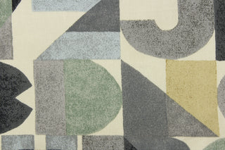 This fabric features a block letter design in gray, charcoal gray, tan or beige, off white, and seafoam green .