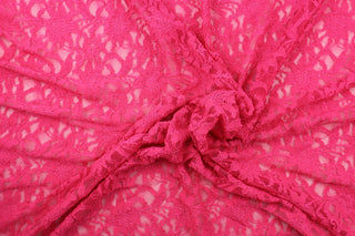  This lace features a ornamental design in a beautiful rich pink with a stretch. 