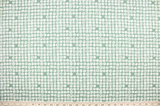 Axel is a multi use fabric featuring a geometrical design in evergreen and white with a soil and stain repellant finish.  It can be used for several different statement projects including window accents (drapery, curtains and swags), decorative pillows, hand bags, bed skirts, duvet covers, upholstery and craft projects.  It has a soft workable feel yet is stable and has a durability rating of 51,000 double rubs.