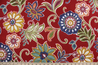 This fabric features a large floral design and is perfect for any project where the fabric will be exposed to the weather.  Able to resist stains and water, and has a rating of 10,000 double rubs, UV tested and can withstand 500 hours of direct sunlight.  Uses include cushions, tablecloths, upholstery projects, decorative pillows and craft projects. This fabric has a slightly stiff feel but is easy to work with.  Colors included are navy blue, olive green, red, berry pink, gold and white.