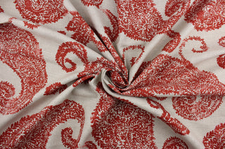 This fabric features a large scale paisley design in red against a stone background.  The multi use fabric is perfect for window treatments, decorative pillows, custom cushions, bedding, upholstery applications and almost any craft project.  This fabric has a soft workable feel yet is stable and durable with 12,000 double rubs.