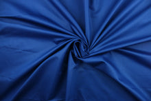 Load image into Gallery viewer, This beautiful solid blue fabric has a smooth and lustrous appearance.  The  fabric offers a crisp hand and a stiff but flexible drape.  The glossy finish makes it great for apparel, drapery lining and much more.   
