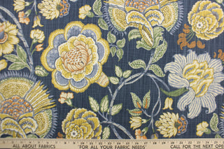 Add a gorgeous pop of color to your interior space with this large print floral design.  Colors include mustard, white, green, light blue and orange on a dark blue background.   Use this fabric for clothing as well as drapery, pillows, bedding, placemats and light upholstery.  The possibilities are endless.