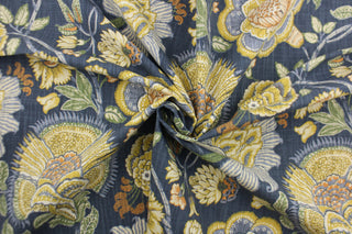 Add a gorgeous pop of color to your interior space with this large print floral design.  Colors include mustard, white, green, light blue and orange on a dark blue background.   Use this fabric for clothing as well as drapery, pillows, bedding, placemats and light upholstery.  The possibilities are endless.