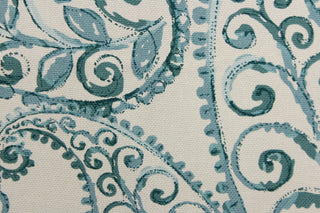 This fabric features a leaf design in a watercolor sea blue against a pale gray. 