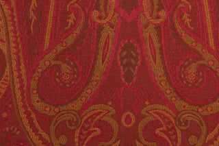 This fabric features a whimsical design in golden tan and brown set against a deep red.