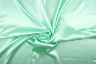  A beautiful satin fabric in a mint green color. 