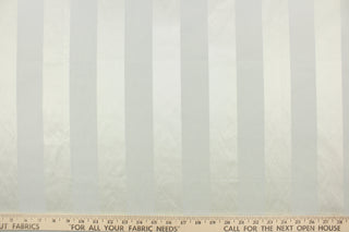 This fabric features a wide stripe design in pale gray with green undertones and a slight shine. 