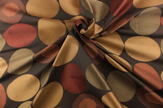 Stylish, modern and contemporary best describe this geometric pattern of circles and ovals in red, gold and brown on a dark brown background .