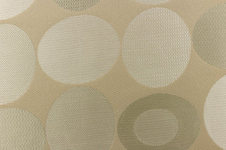  Stylish, modern and contemporary best describe this geometric pattern of circles and ovals in light gold or cream colors on a khaki background.
