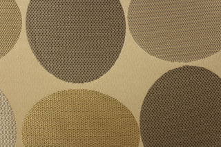 Geometric pattern of circles and ovals in gold tones on a khaki background
