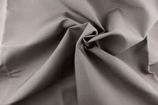 This fabric in a solid light  gray color is great for umbrellas, outdoor upholstery and more. 