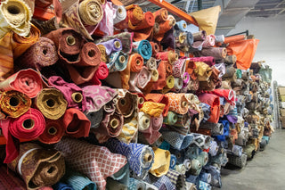 Rolls of fabric at All About Fabrics Warehouse